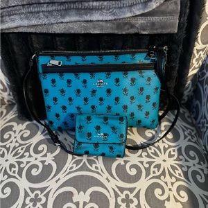 Coach crossbody with matching wallet.